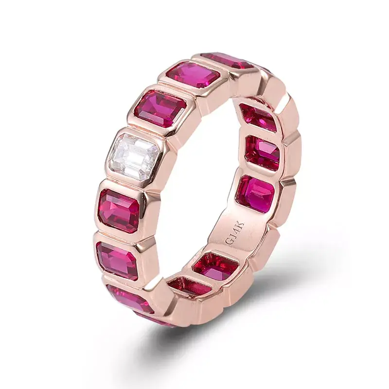 Full eternity ring with emerald-cut lab rubies and diamond accent