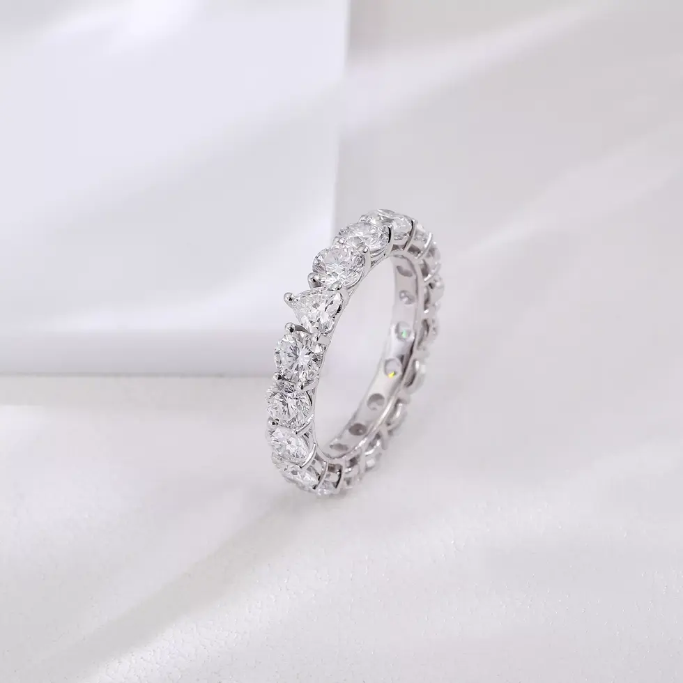 Diamond eternity band showing heart-shaped centre stone