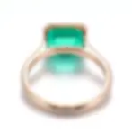 Emerald cut Colombian emerald ring with minimalist gold band