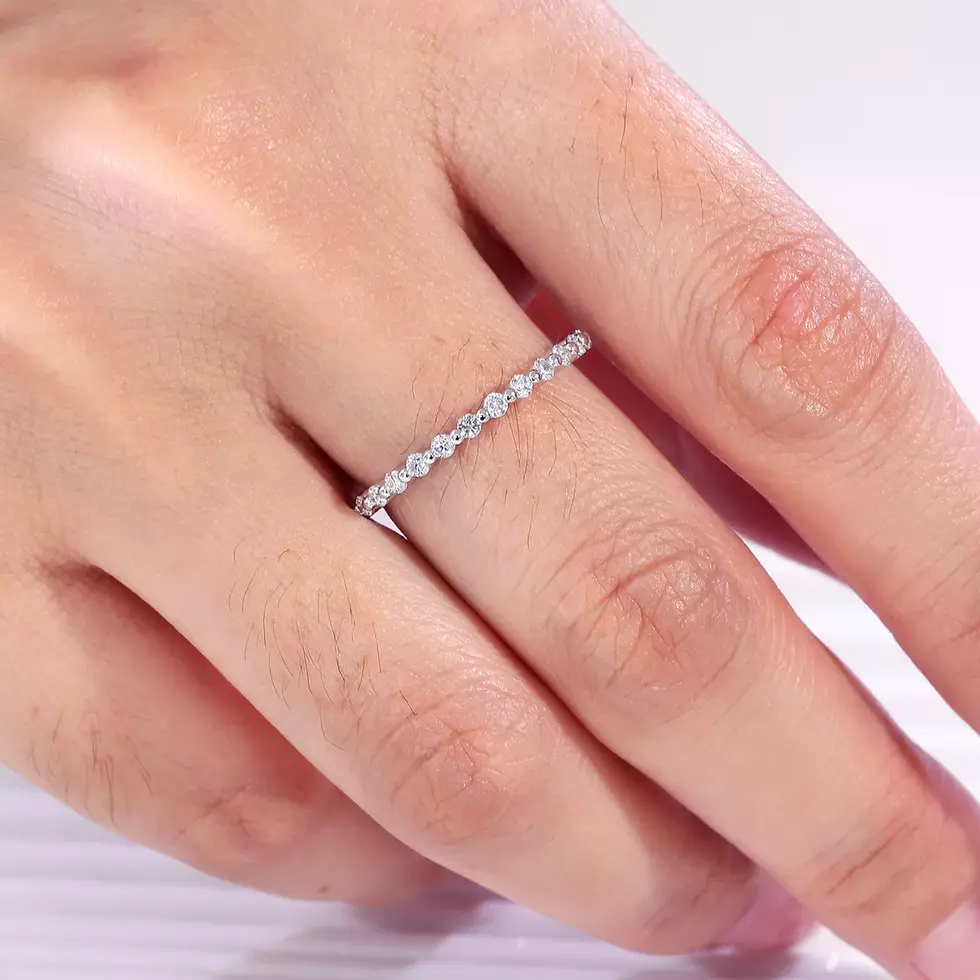 Half eternity diamond ring worn on hand