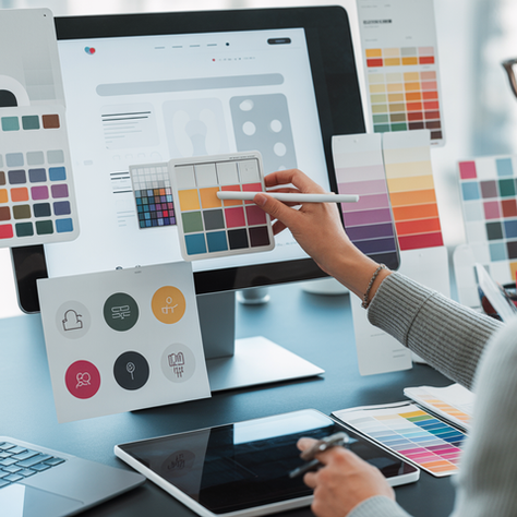 Designer choosing a brand color palette on a digital screen for business branding and logo design