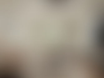 Modern family relaxing in a bright, spacious living room of a manufactured home in Texas, showcasing stylish interior design and comfort.