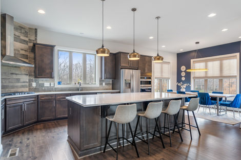 Kitchen island and breakfast seating beside the dining area.