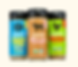 Three Cubberd seasoning bottles for light fish, steak and chicken, with colorful blue, tan and green labels on a plain background