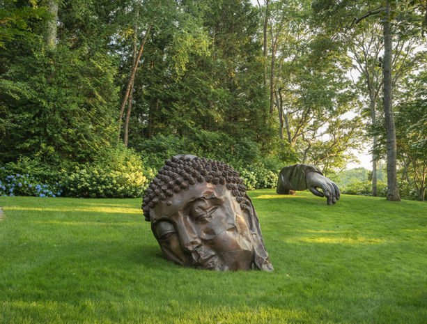 Outdoor view of Arne Glimcher's Sculpture Garden with modern sculptures on display