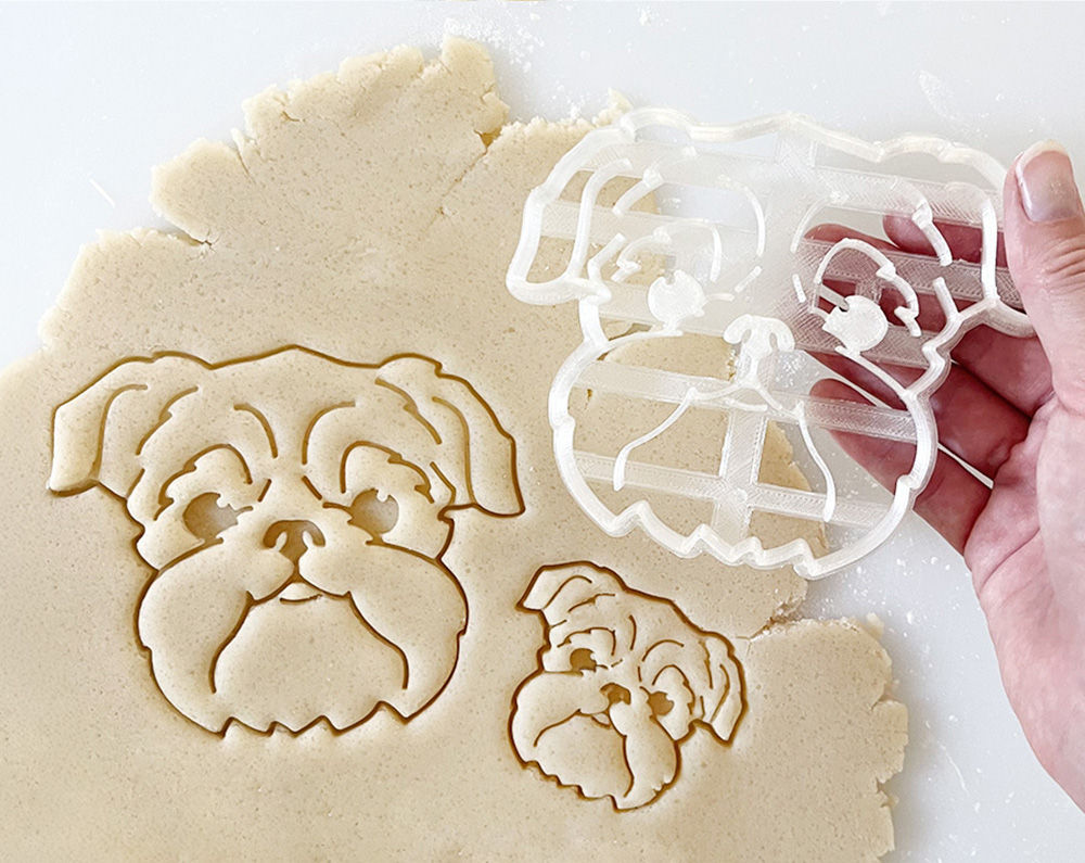Brussels Griffon Cookie Cutter held above cookie imprint