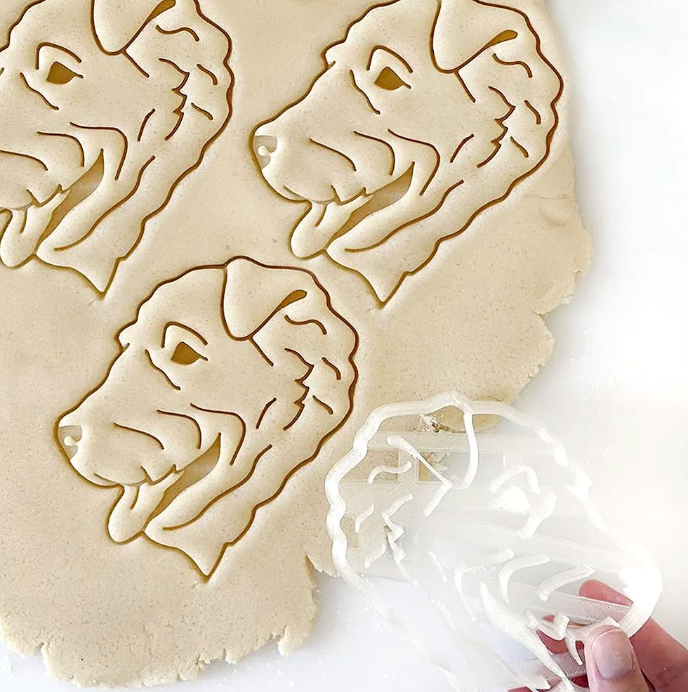 Airedale Terrier Dog Portrait imprinted on the rolled out dough with cookie cutter