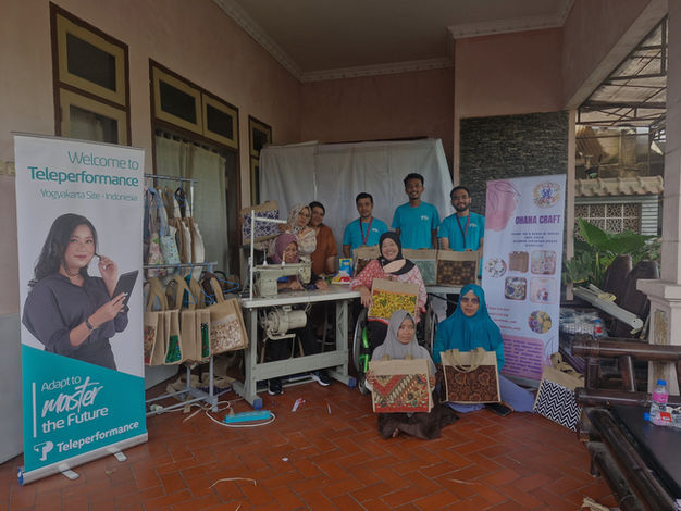 Teleperformance team presenting handmade bags and banners, Welcome to Teleperformance, Access to Master the Future