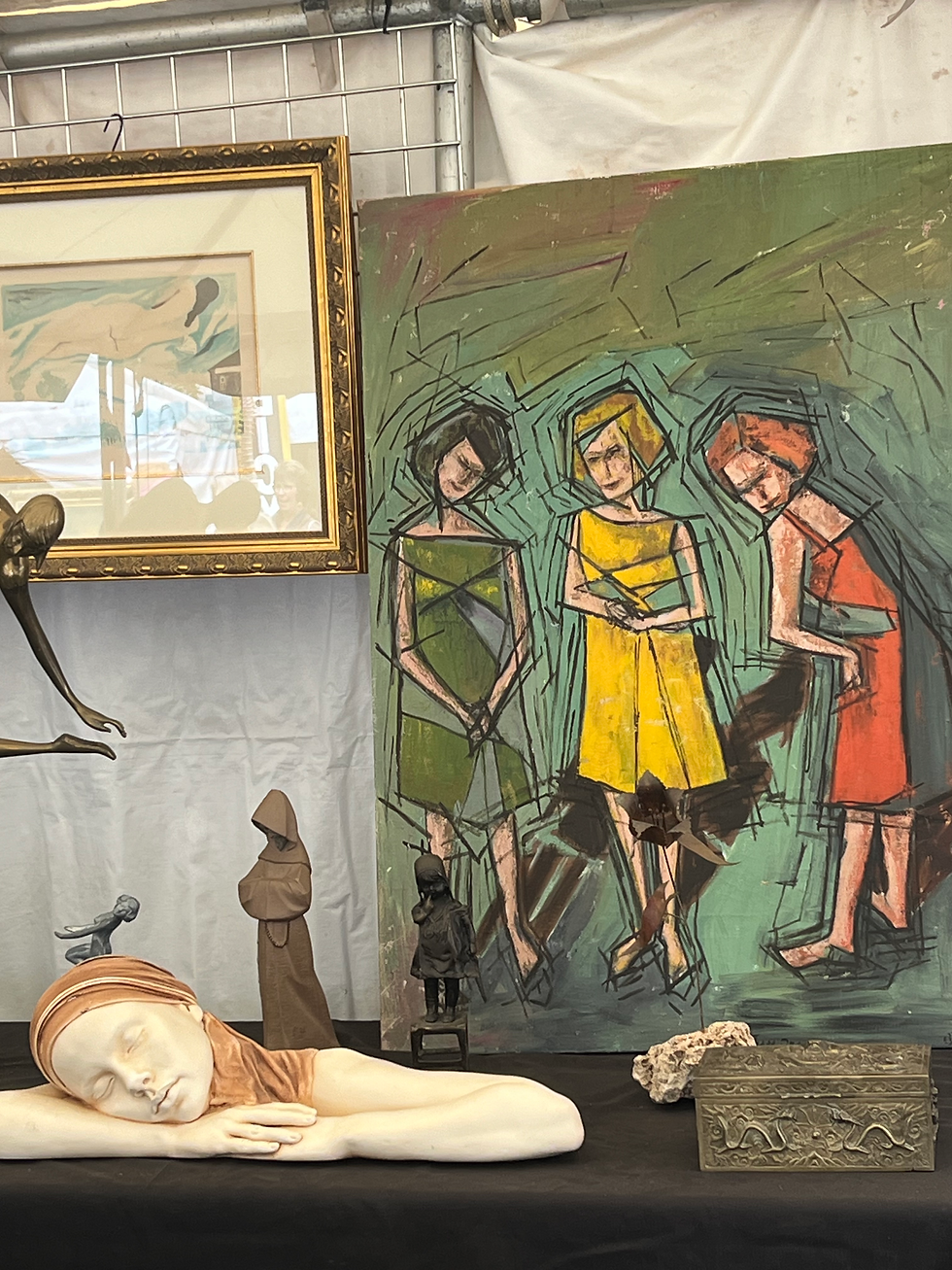 A mid century painting and other art are displayed