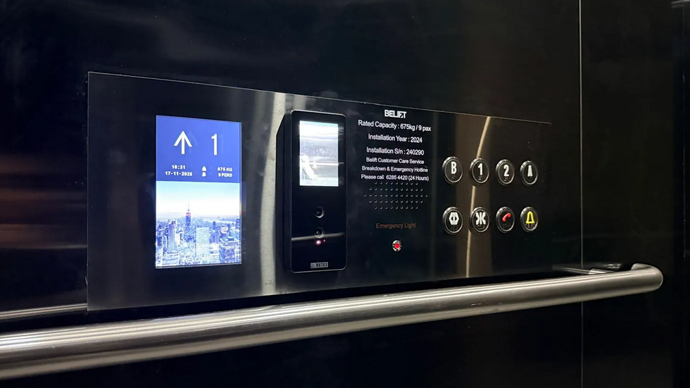 Black elevator control panel installed by BELIFT with blue screen showing up arrow and 1, floor buttons B, 1, 2, A, and emergency light.