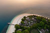 Aerial view of Nikoi Private Island surrounded by turquoise water