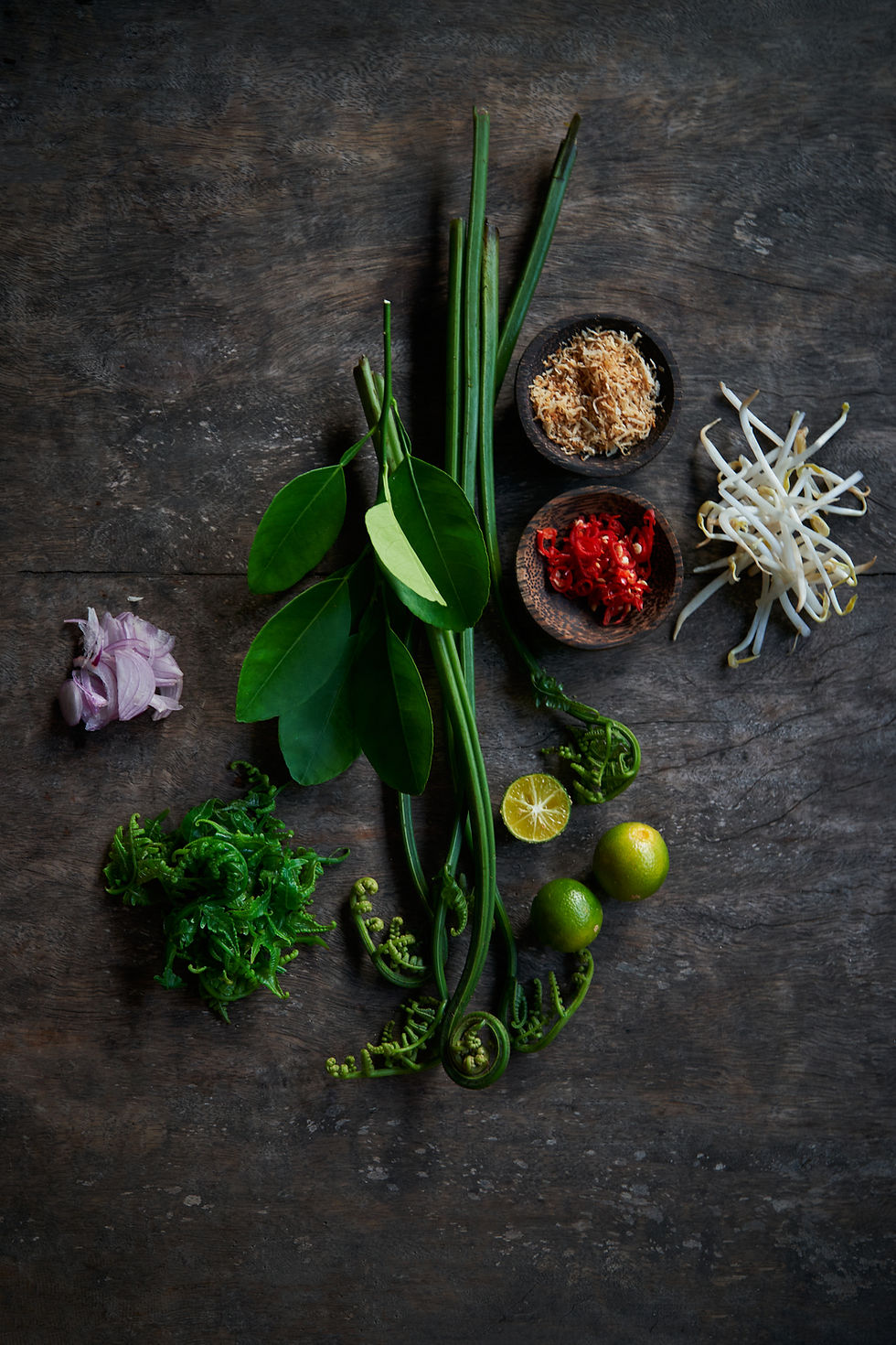 Fresh herbs and vegetables on a kitchen counter at Nikoi Private Island