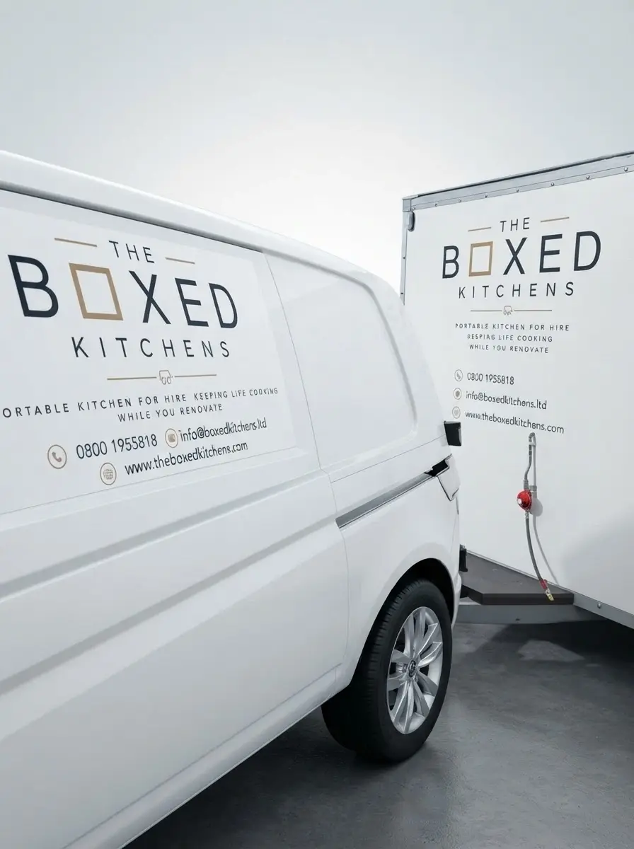 Commercial photography of a white van and trailer branded with "The Boxed Kitchens". This highlights their portable kitchen service with a professional and clean aesthetic.