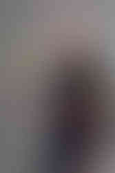 Professional portrait of an Olympic softball player with confident expression in a clean studio setting in Orange County