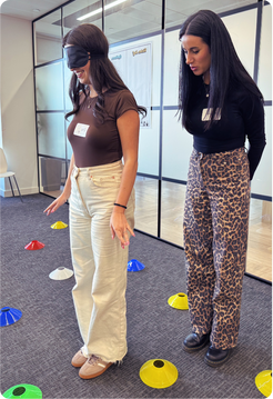 Team members taking part in a Curious Minds UK team building activity