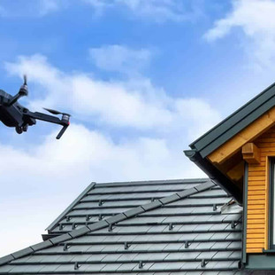 Drone photographing a metal roof