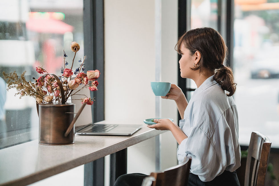 Women sitting drinking tea and looking out the window