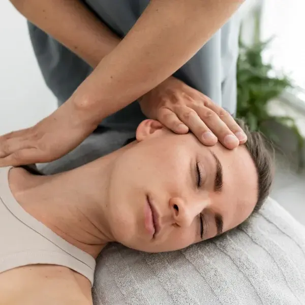 A woman receiving an anti-stress massage in a serene spa environment, promoting relaxation and well-being.