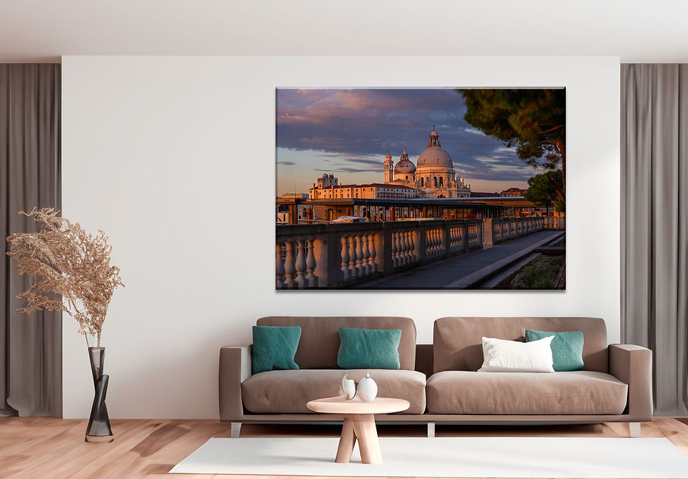 View of the Basilica di Santa Maria della Salute in Venice, Italy, during golden hour, with warm sunlight illuminating the do