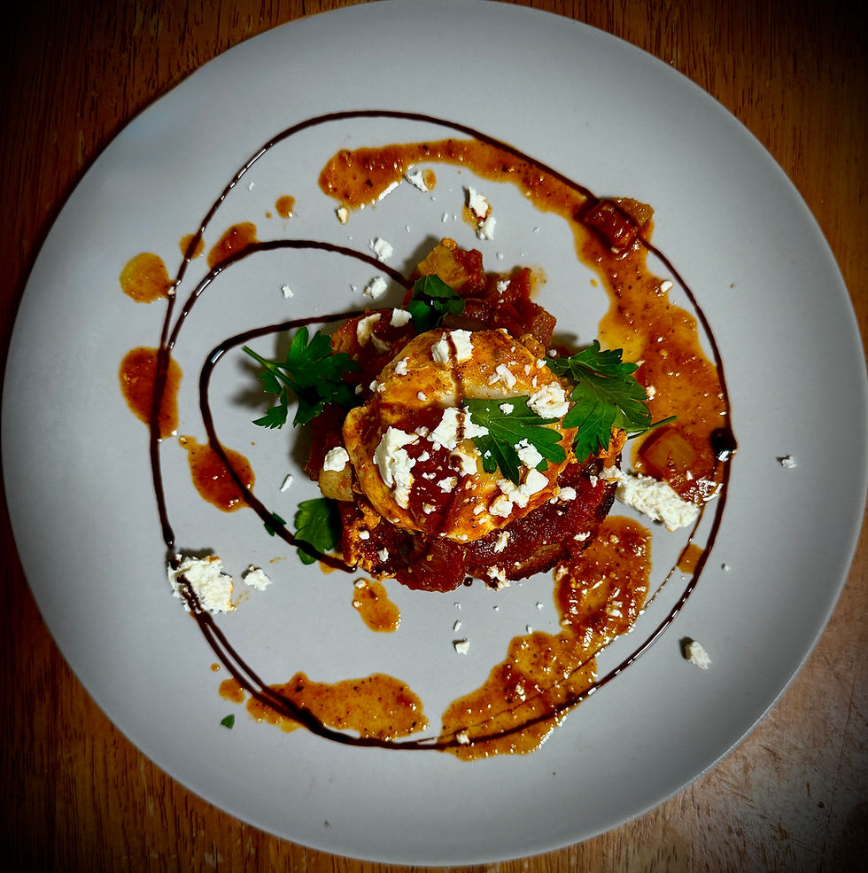 Shakshuka (a Northern African dish of spiced tomatoes, chili peppers, poached eggs) A traditional dinner meal that is great for brunches and pairs well for semi-dry rieslings