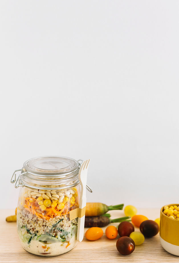 fresh-spring-salad-closed-jar-with-white-fork-vegetables-wooden-table (1).jpg