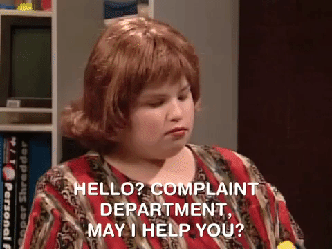 gif from the tv show All That of Lori Beth answering a phone and saying "Hello? Complaint department, May I help you?"