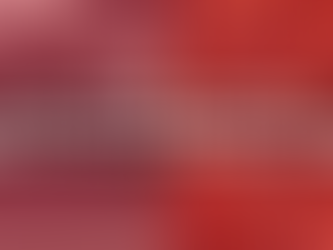 Protesters march holding signs; text reads "60 years on from the 1965 Race Relations Act." A diverse group is in the background.