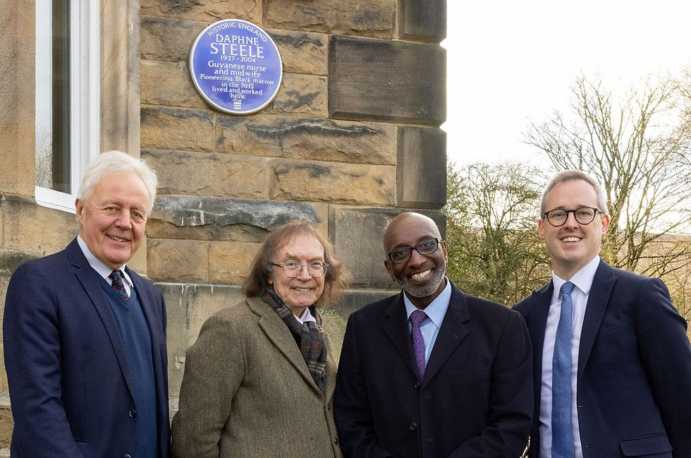 The presentation revealing the blue plaque to Daphne Steele was attended by (from left to right) Duncan Wilson, Historic England CEO; Professor Ronald Hutton, Blue Plaque Panel Interim Chair; Robert Steele, son of Daphne Steele; and Lord Parkinson of Whitley Bay, Arts and Heritage Minister at the Department for Digital, Culture, Media and Sport (DCMS). © Historic England.