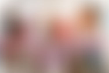 Women at a table discussing & reviewing issues