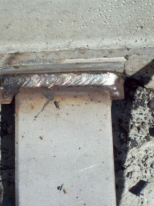 MassDOT stainless steel certified welders working on water storage tank