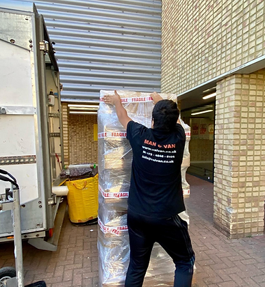 A VaiVan packer mover porter packing a shelving unit from a single item move for a commercial client