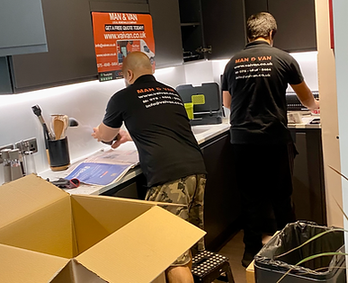 2 VaiVan mover porters providing packing and moving services packing a 2 bedroom apartment-flat kitchen