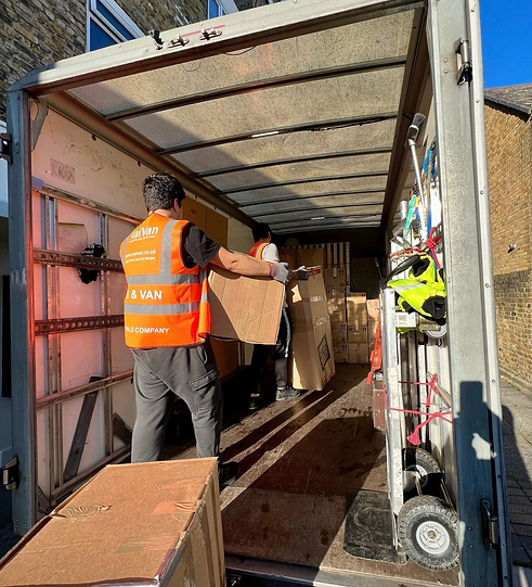 2 VaiVan porter movers loading a luton van with cardboard boxes during a 2 bedroom apartment-flat packing and moving service in Putney
