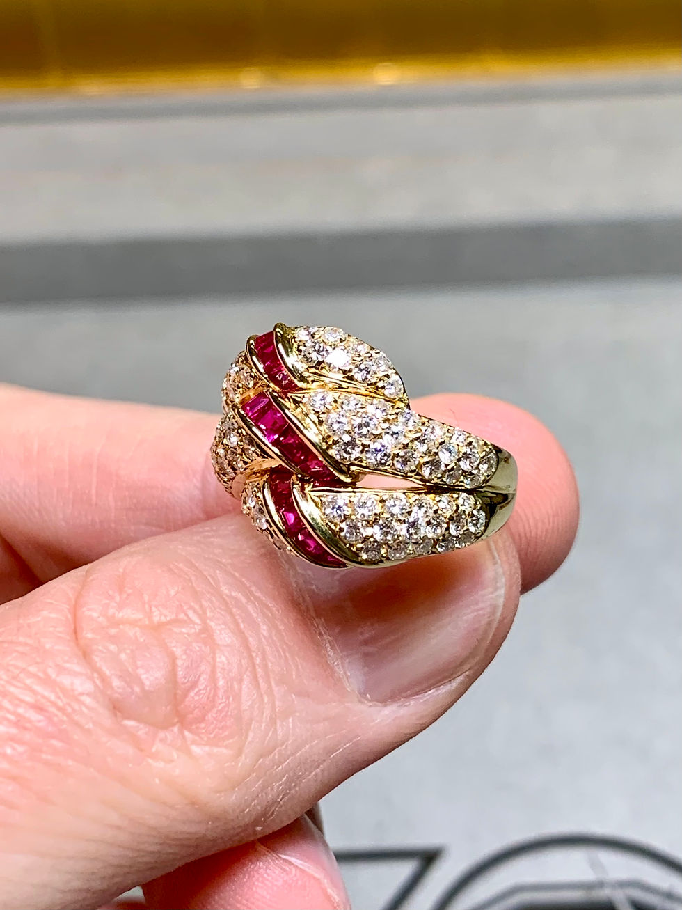 Thumbnail: Estate 18K Pavé Diamond Bypass Carré Cut Ruby Ribbon Cocktail Ring