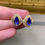 Thumbnail: Estate 14K Pear Tanzanite Baguette Diamond Omega Back Huggie Earrings 5ctw