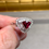 Thumbnail: Estate Platium Triangular Ruby Baguette Round Diamond Halo Cocktail Ring