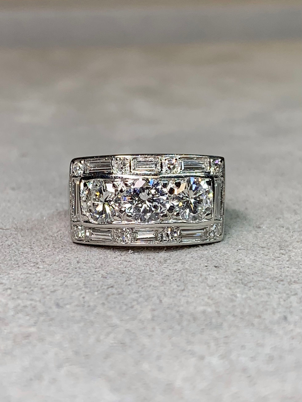 Thumbnail: Vintage 1940’s Platinum 3 Stone Baguette Round Diamond Cigar Band Ring