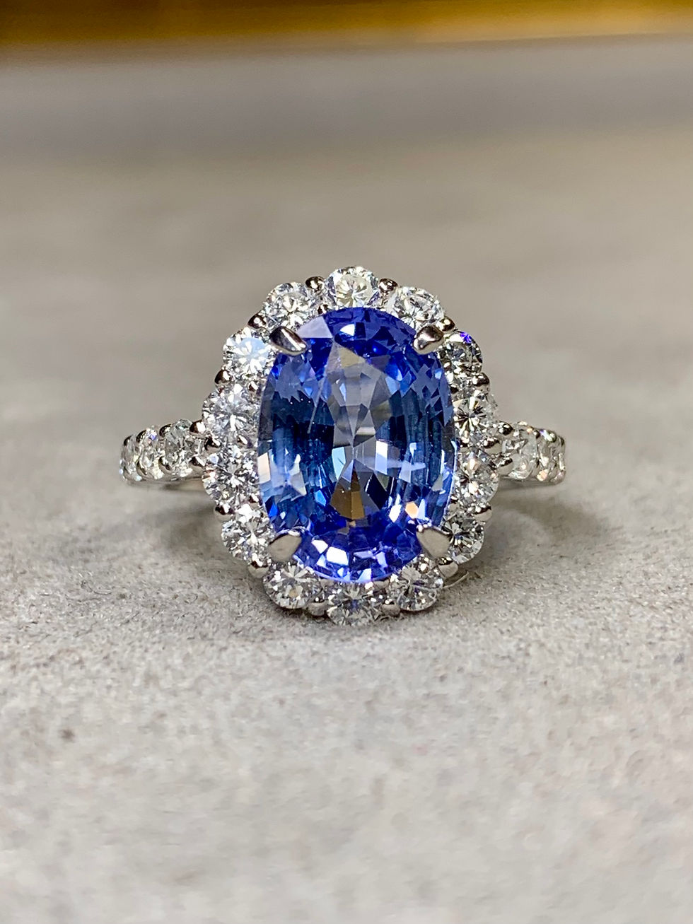 Thumbnail: Classic Platinum Cornflower Blue Oval Sapphire Diamond Halo Cocktail Ring