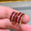 Thumbnail: Estate 18K Mystery Set Vivid Ruby Princess Diamond Huggie Earrings Omega Backs
