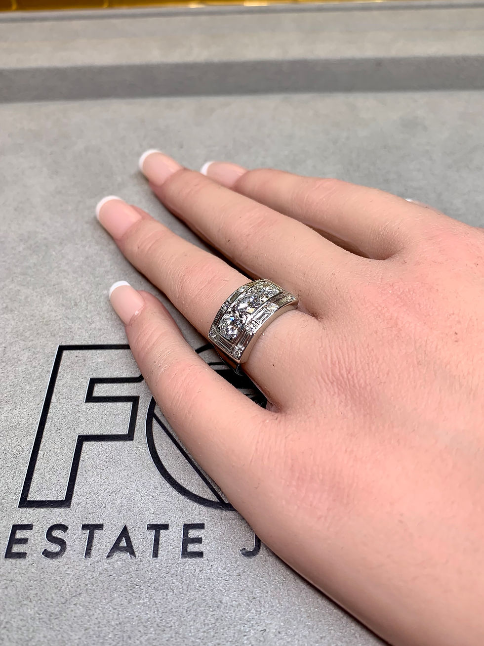 Thumbnail: Vintage 1940’s Platinum 3 Stone Baguette Round Diamond Cigar Band Ring