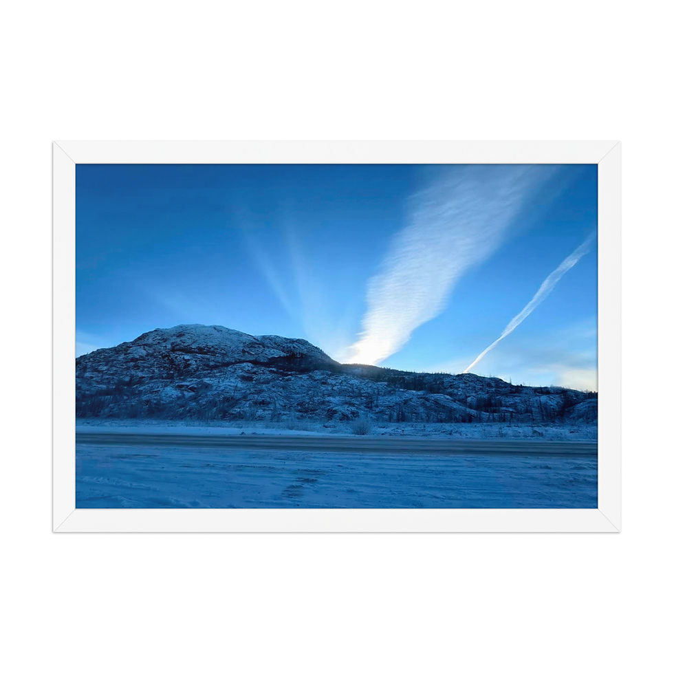 Alaska mountain range beneath glowing clouds at twilight in a framed print