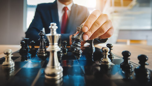 Businessman moving chess piece on chess board game concept for ideas and competition and s