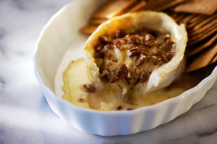 baked brie crusted with pecans and drizzled with honey