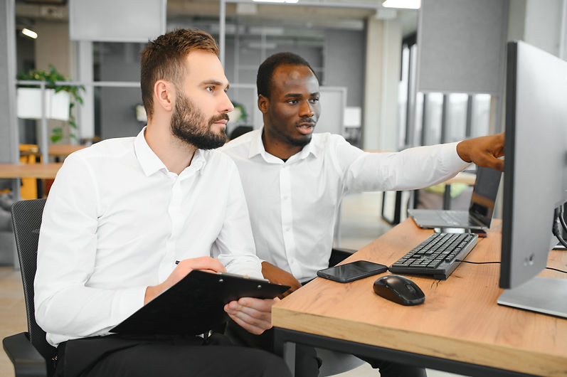 two-successful-trader-sitting-in-office-checking-2024-02-21-01-52-41-utc.jpg