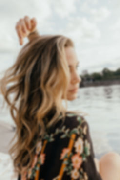 Woman with beach waves and lived in highlights colored, cut and styled by Tessa Matsis Smith on Willamette River in Portland Oregon