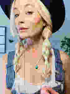 The topsy tail braid technique worn by Tessa Matsis Smith.