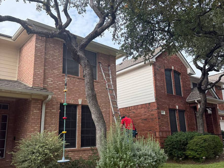 SecuriMax technician working on an exterior camera installation at a Round Rock home