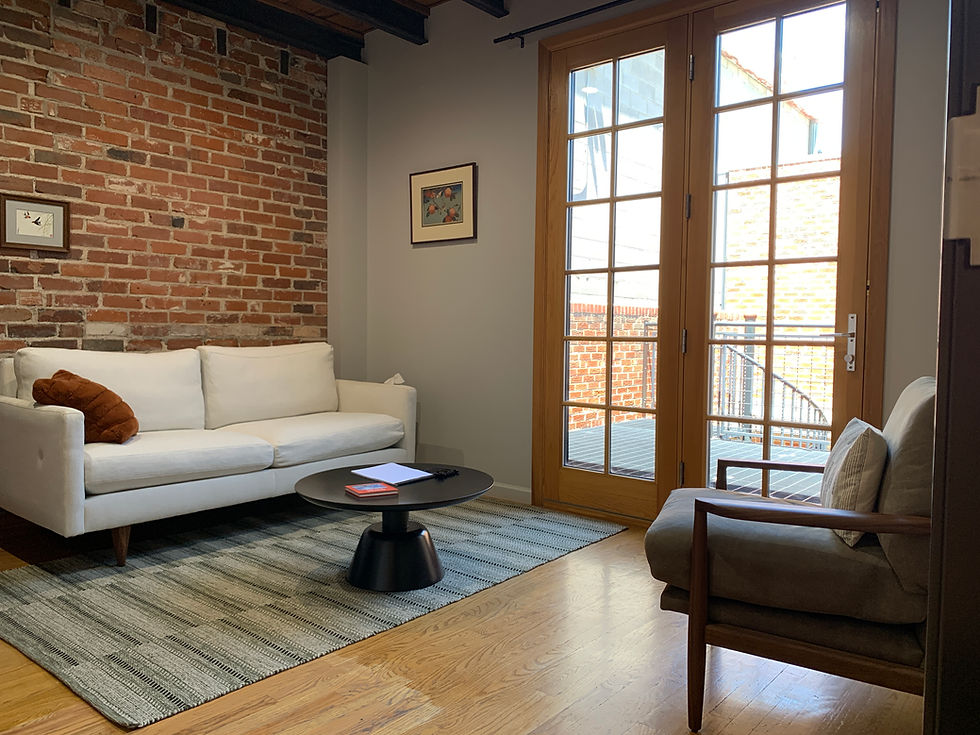 Eye-level view of a cozy therapy room with a comfortable chair and calming decor