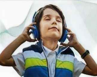 Young man is caught up iLs music selections on the headphones