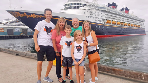 Family photo in front of the Disney Wonder